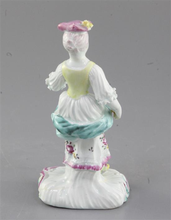 A Derby Pale Family figure of a standing girl, c. 1758, h. 15cm, repairs